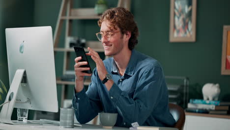 man using smartphone in home office