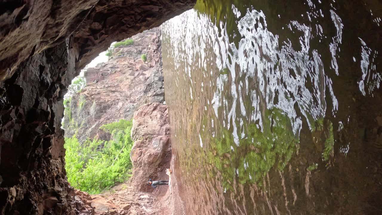 Exploring a Cave by the Lake