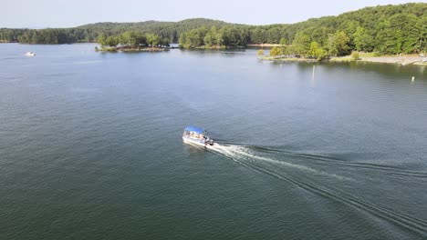 Boat-moving-across-the-water-at-full-speed-while-the-camera-moves-around-it