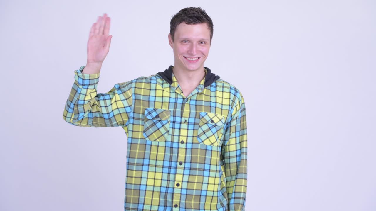 joven feliz y guapo hombre hipster