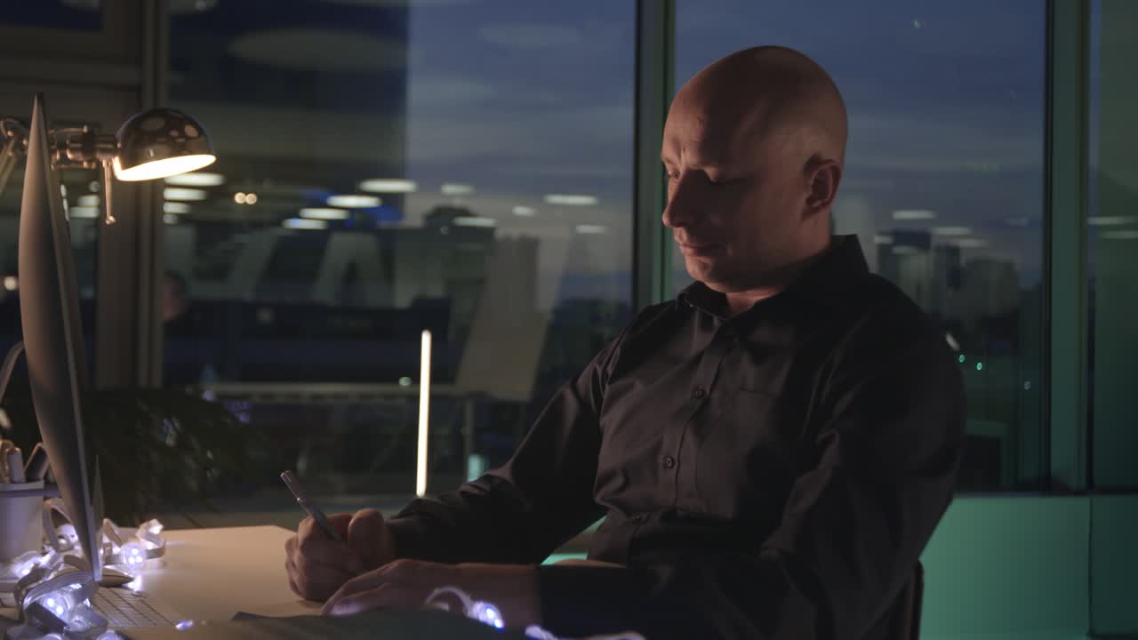 Man Working Late at Night in Modern Office