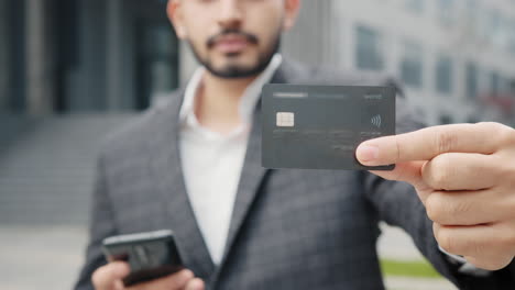 man showing credit card