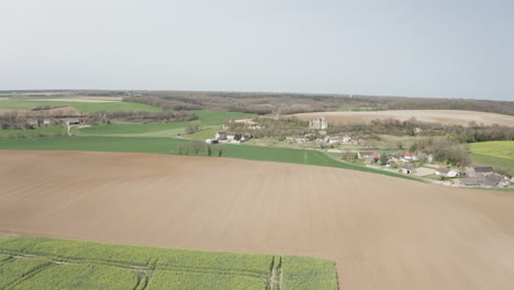 aerial drone point of view of rapeseed fields near to avon-les-roches in the loire valley, france
