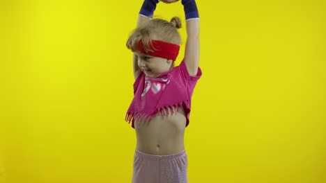 Young-cute-girl-in-sportswear-making-fitness-gymnast-home-exercises.-Workout-for-kids.-Sporty-child
