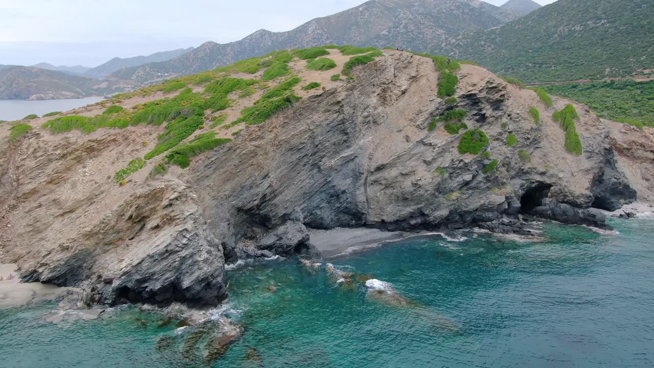 Aerial rising shot above protected lagoon and rugged coastline of Crete