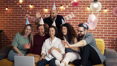 group of people at home celebrating having video call, singing happy birthday