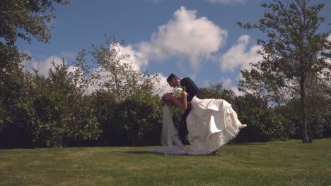 Beautiful-newlywed-couple-embracing-and-kissing