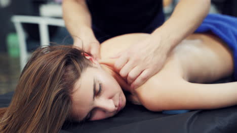 woman in spa salon having massage. beautiful woman lying down on the bed relax in spa salon