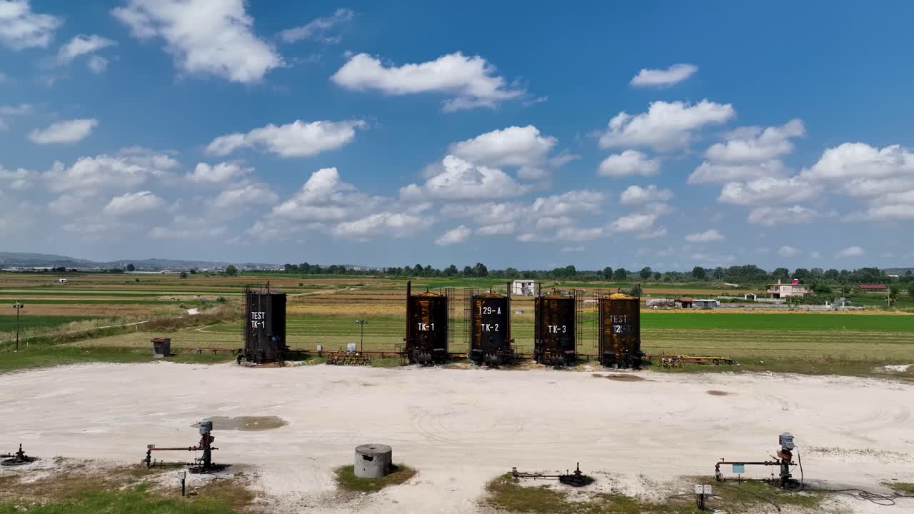 Fuel deposit tanks near a farming field on rural land
