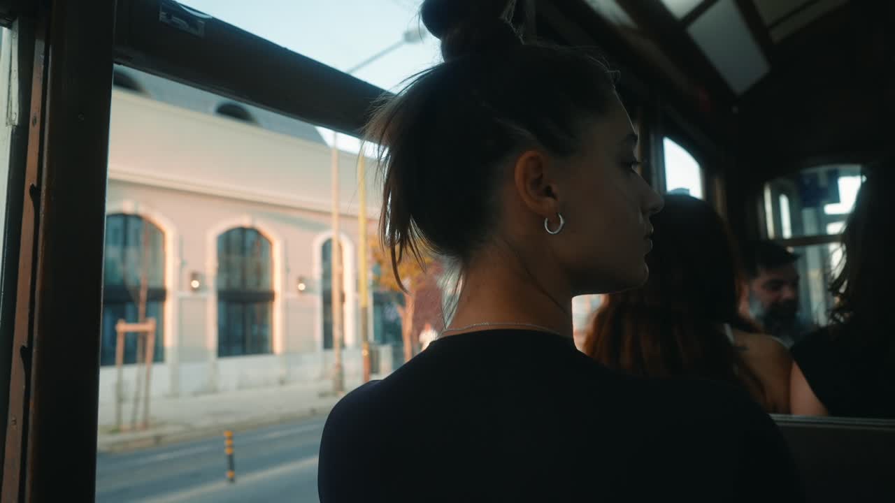 Woman looking out the window of a tram