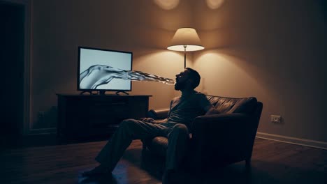 man watching tv with an imaginary connection