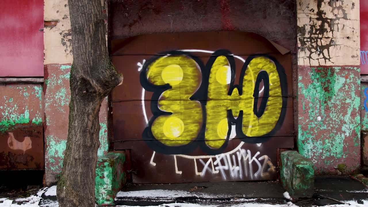 Sliding camera, graphitic Rossi on the wall of an abandoned Soviet building