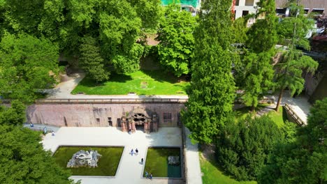 4k aerial drone video of gardens surrounding the historic castle on königstuhl hill overlooking heidelberg, germany