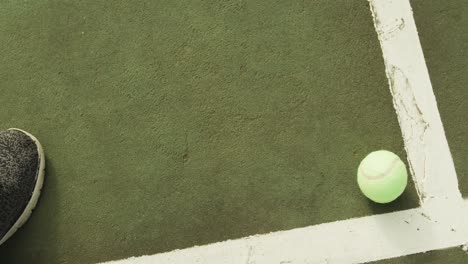 Video-of-one-green-tennis-ball-on-the-green-court