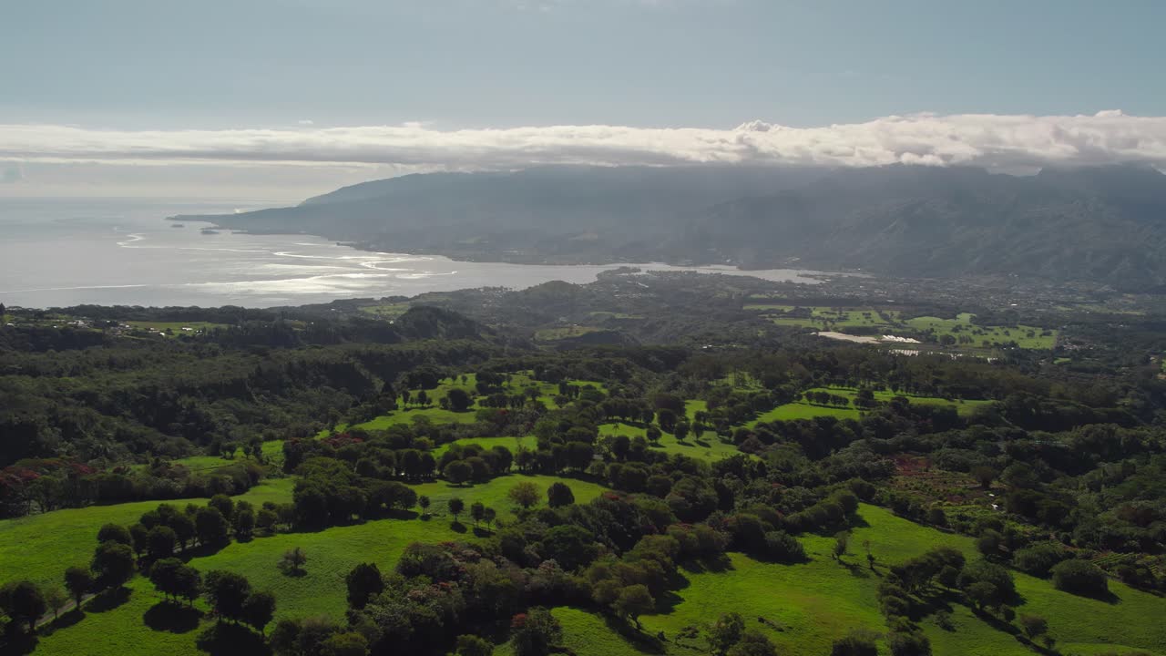 Slow Rising Aerial Drone Footage of Tahiti Island from Mountain Top