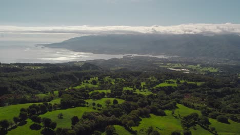 slow rising aerial drone footage of tahiti island from mountain top