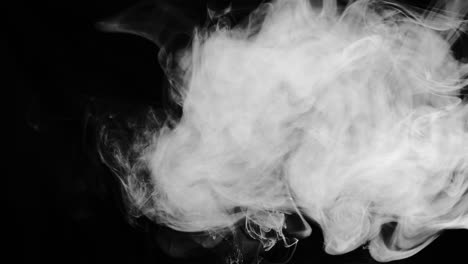 Slow-motion-smoke-cloud-swirls-around-and-drifts-right