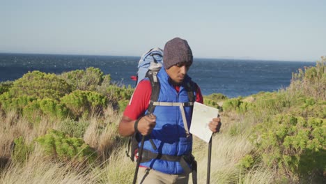 mixed race man with prosthetic leg hiking in nature