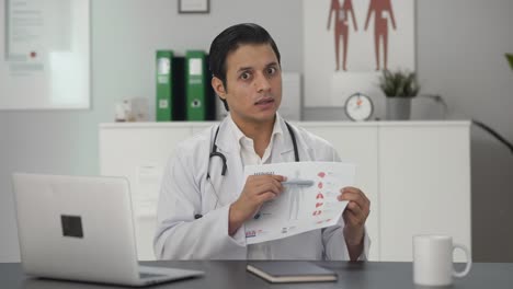 Indian-doctor-explaining-medical-report-to-patient