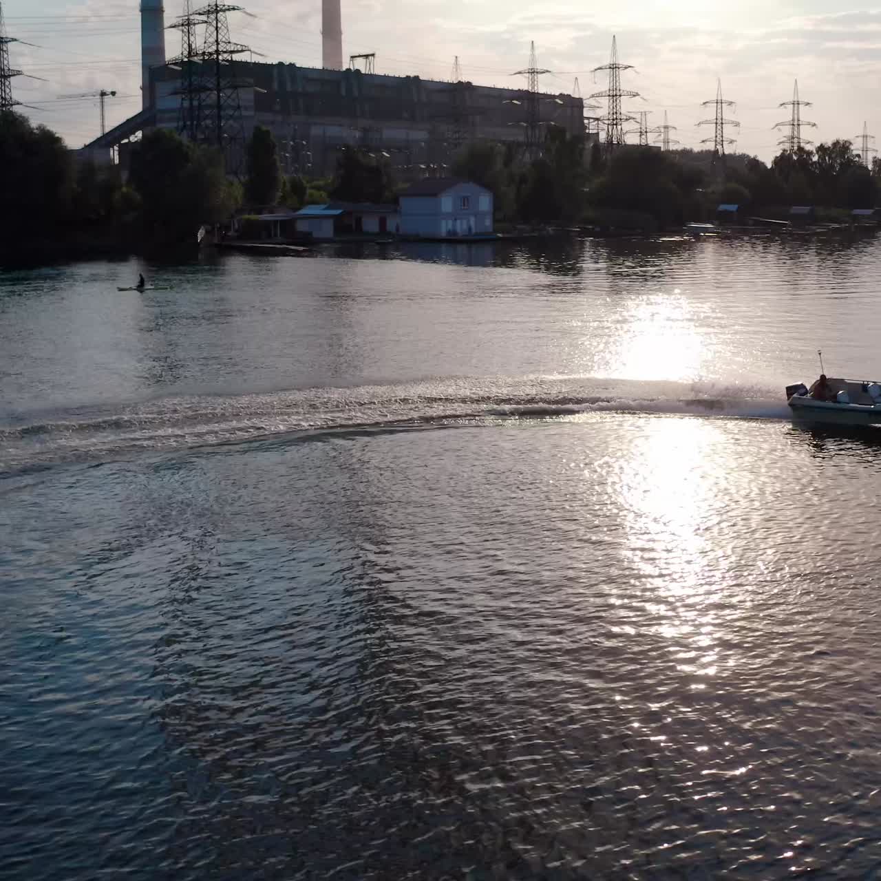 White speed boat floats on river