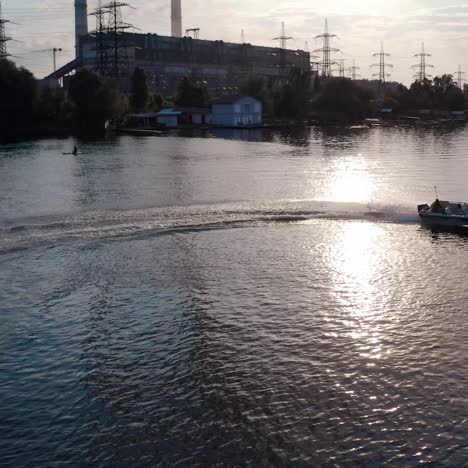 white speed boat floats on river