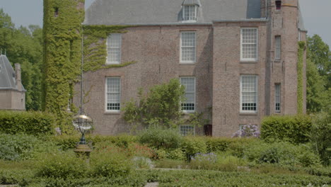 tilt up to beautiful castle seen from beautiful green garden