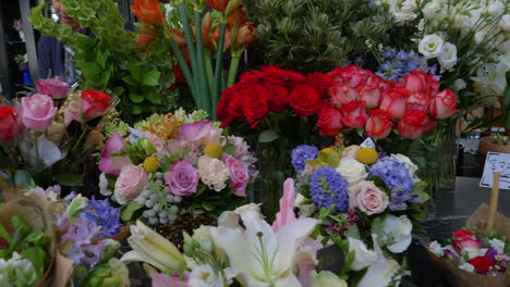 flowers for sale at a roadside both