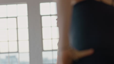 yoga class of pregnant women exercising healthy lifestyle practicing stretches enjoying group physical fitness workout in studio at sunrise