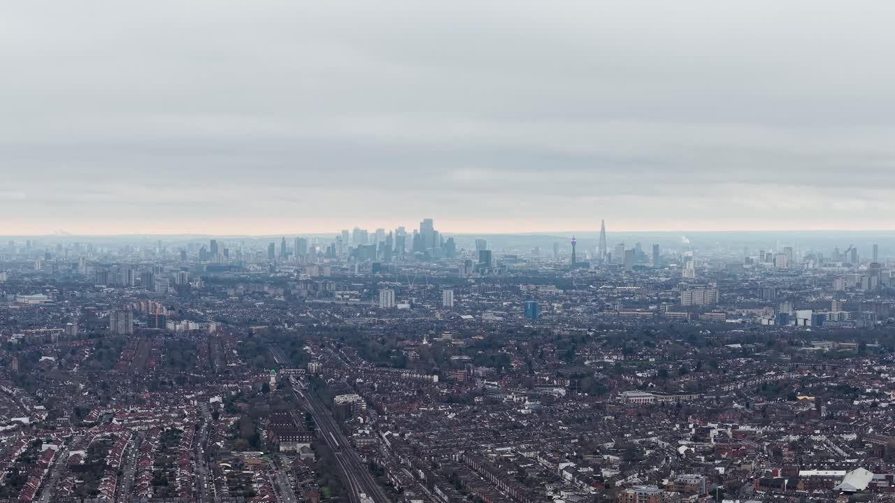 Aerial view overlooking London cityscape skyline in the distance from downtown Wembley city suburbs