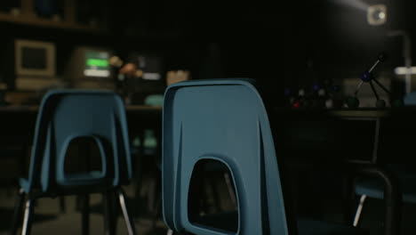 empty classroom with blue chairs