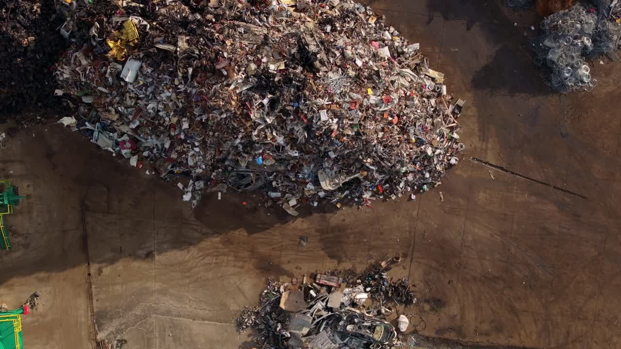 Drone shot of a salvage yard handling massive steel beams, Albania