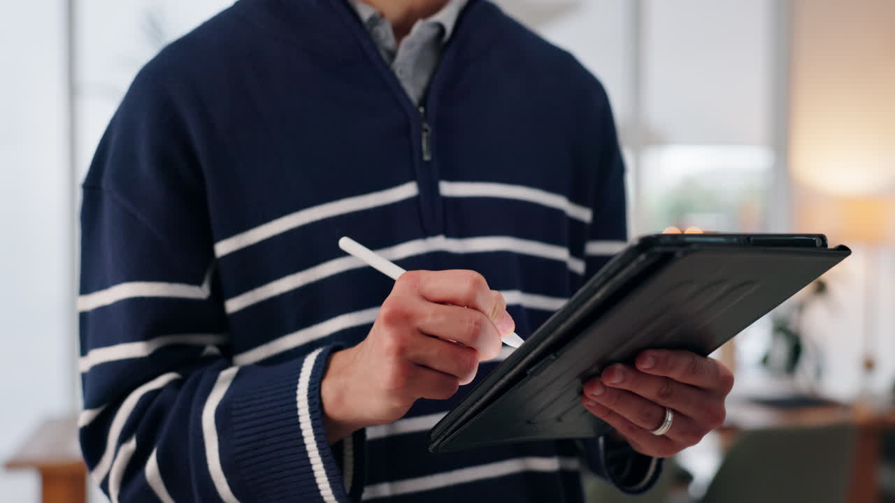 Man using tablet with stylus