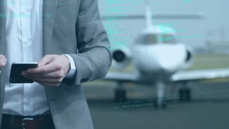 animation of data processing over businessman using smartphone on the airport