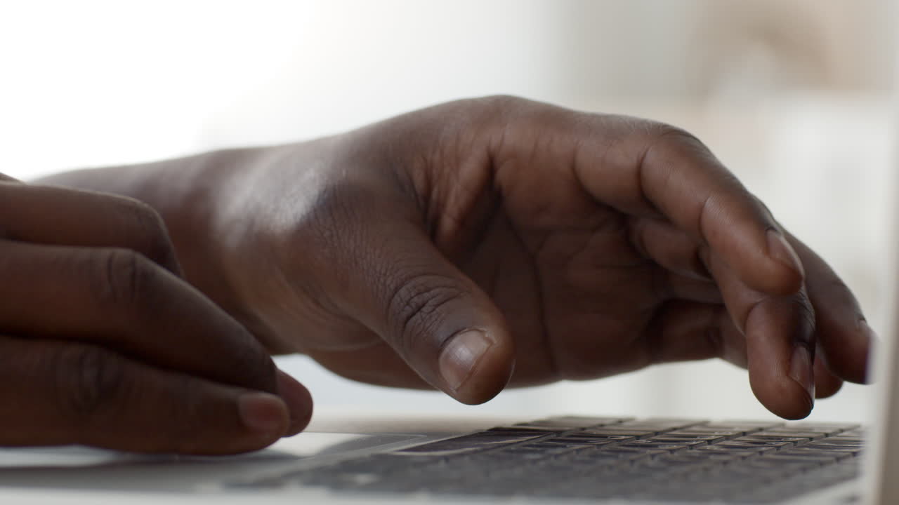 Person Typing on a Laptop