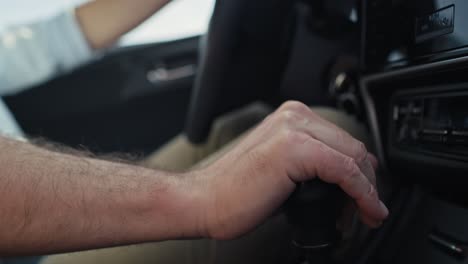 Close-up-of--hand-of-unrecognizable-man-changing-gear-in-the-car.