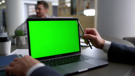 unrecognizable financial employee using laptop