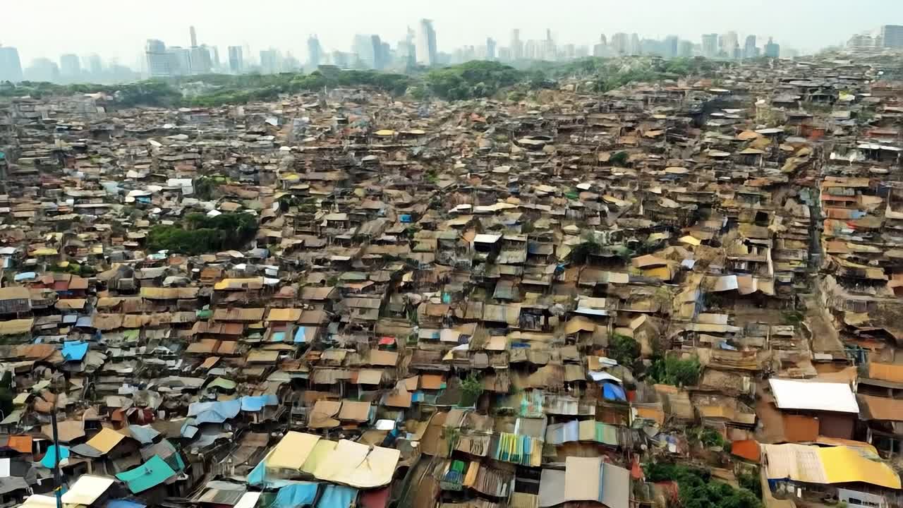 Densely packed slum housing in mumbai contrasting with the modern city skyline in the background