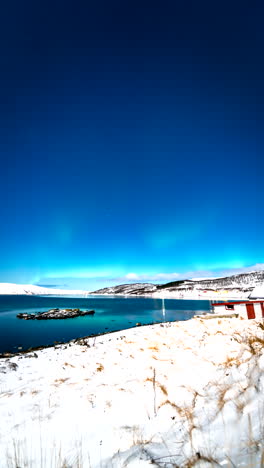 vertical view of rural homes village near skogsfjord in norway. time-lapse