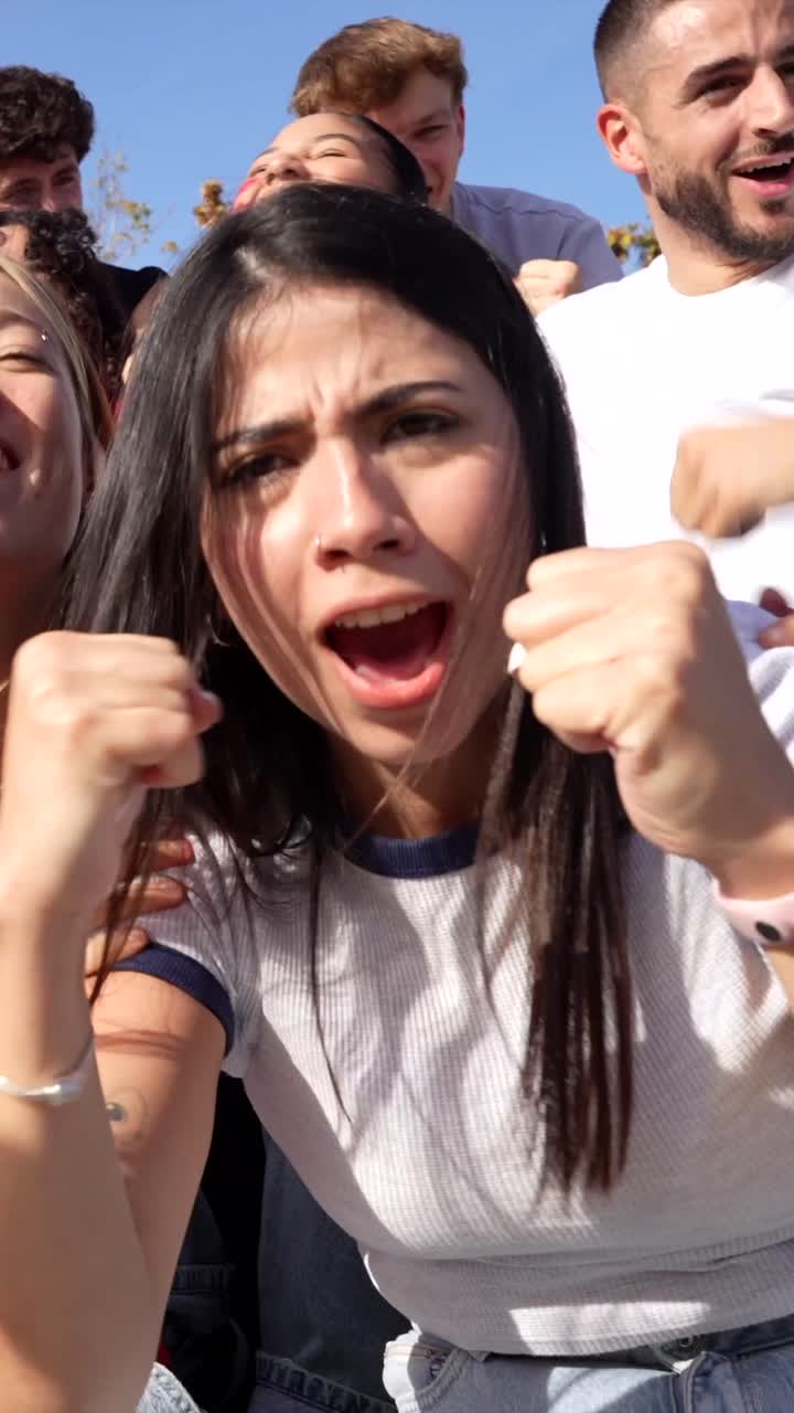 Enthusiastic Fans Cheering at a Sports Event