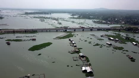 aerial view of a river with houses and fish farms