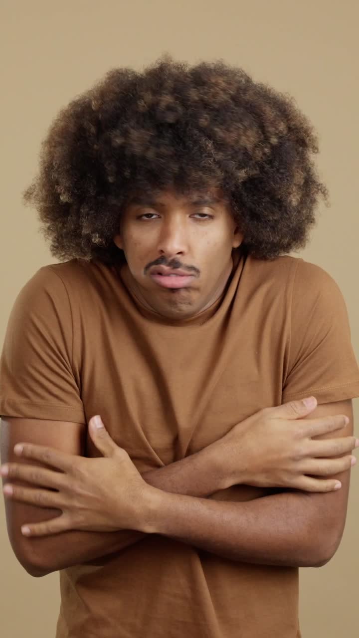 Man Shivering and Feeling Cold Indoors