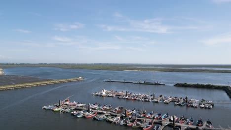 Aerial-panorama-of-Cais-do-Bico,-traditional-boats-docked-in-Murtosa,-Aveiro