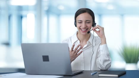 happy indian call center girl talking to the customer