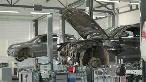 cars undergoing maintenance in auto repair shop