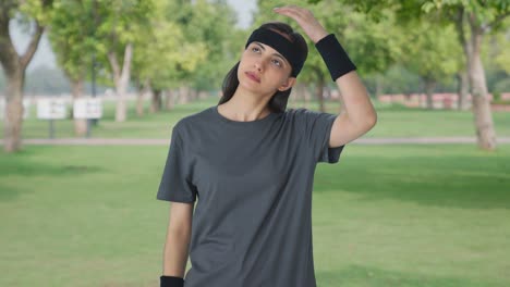 indian girl doing neck stretching