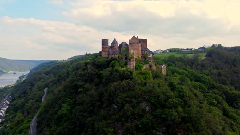 romantic medieval schoenburg castle hotel in oberwesel, germany on lush schönburg hilltop