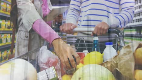 animation of financial data over midsection of diverse couple shopping at market with tablet