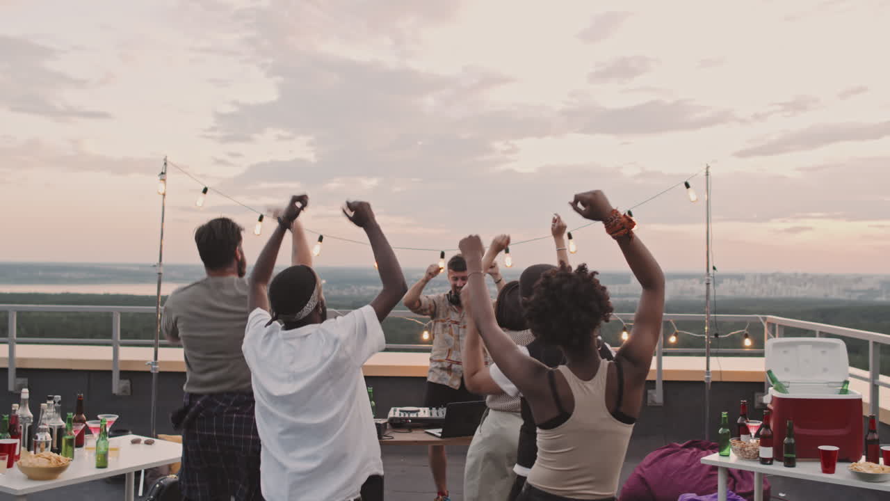 Group of People Partying on Rooftop Terrance