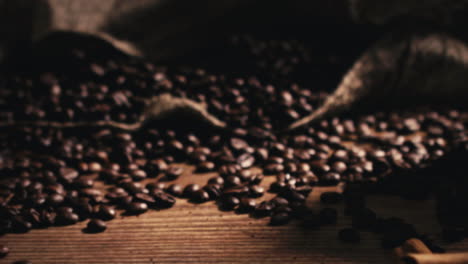 camera moving away and focusing on a bag with freshly roasted coffee beans on a wooden table