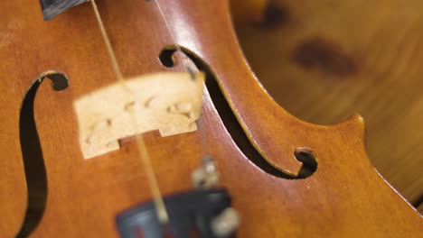 wooden old violin revealed in a smood panning slow motion